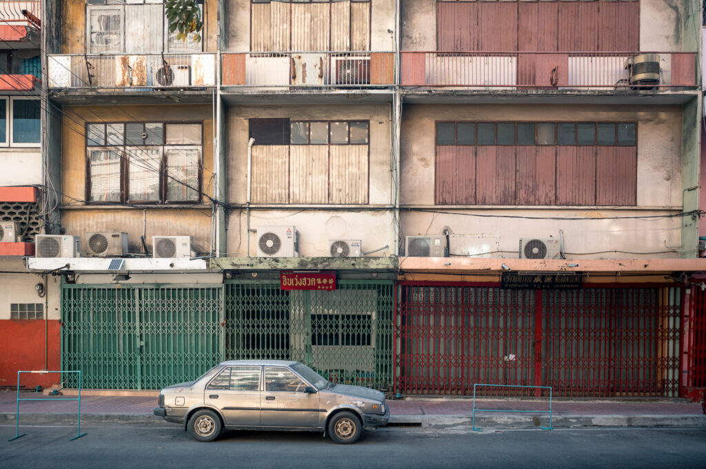 closed shops in Bangkok. an old car in Bangkok.